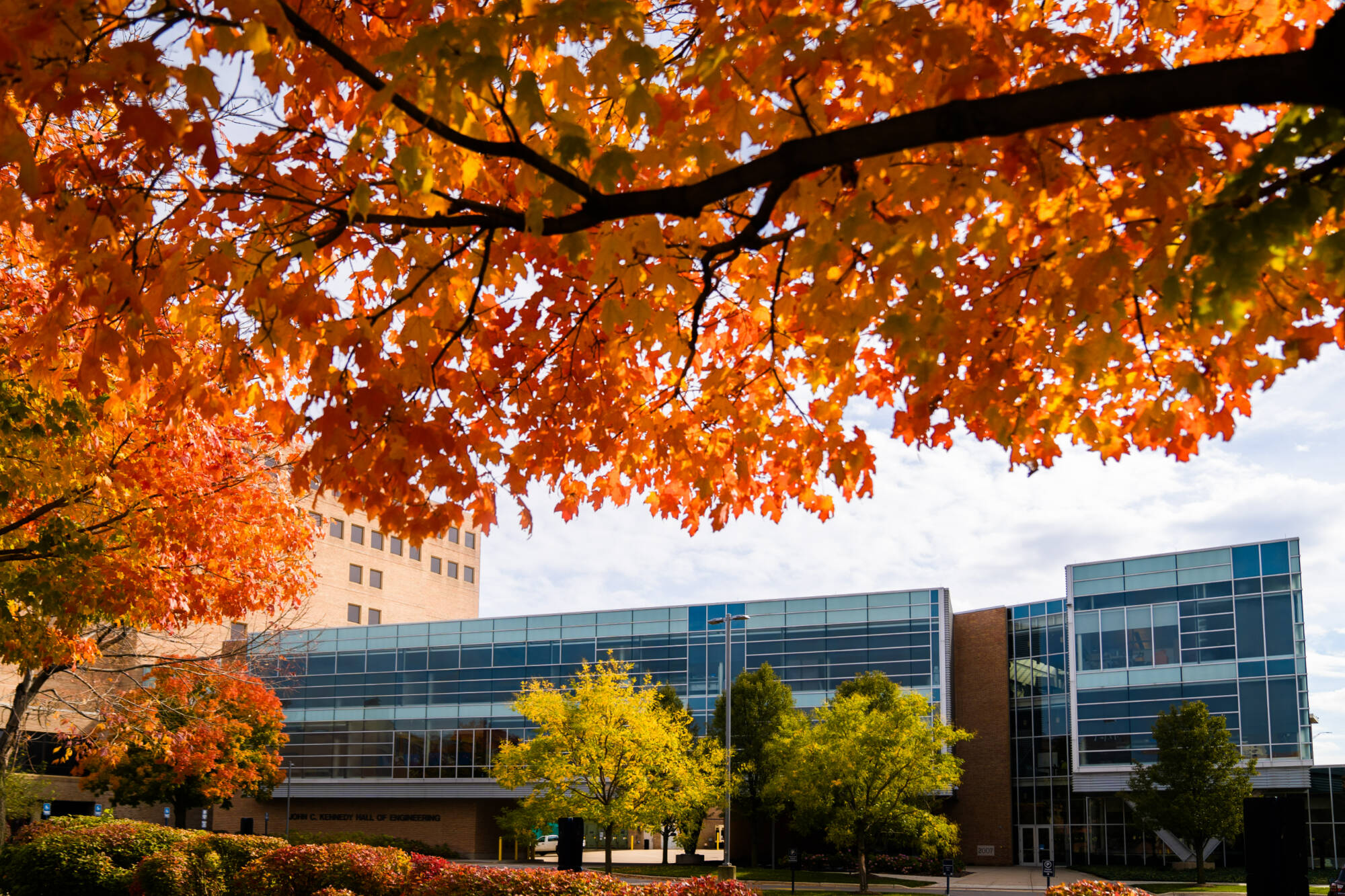 Wide shot of Kennedy Hall Of engineering in the fall